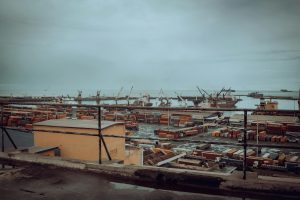 Tema Port in Ghana with shipping containers and cranes, illustrating Africa freight forwarding trade lanes and partner coverage.