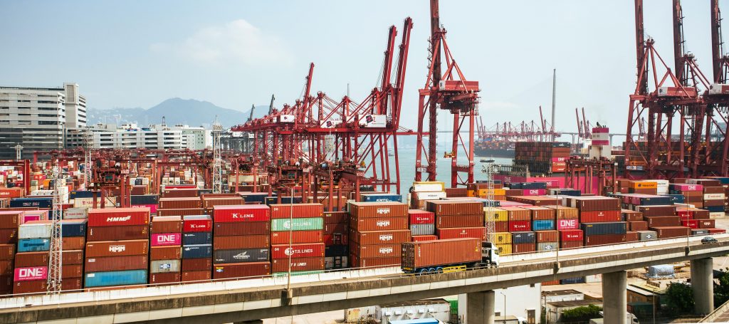 Cargo containers and cranes at an Asian port representing freight partner discovery across Asia trade lanes
