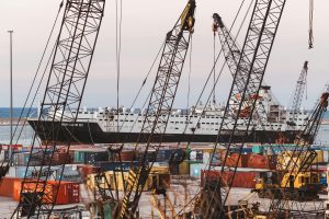 Container port and cranes representing Middle East freight forwarding trade lanes