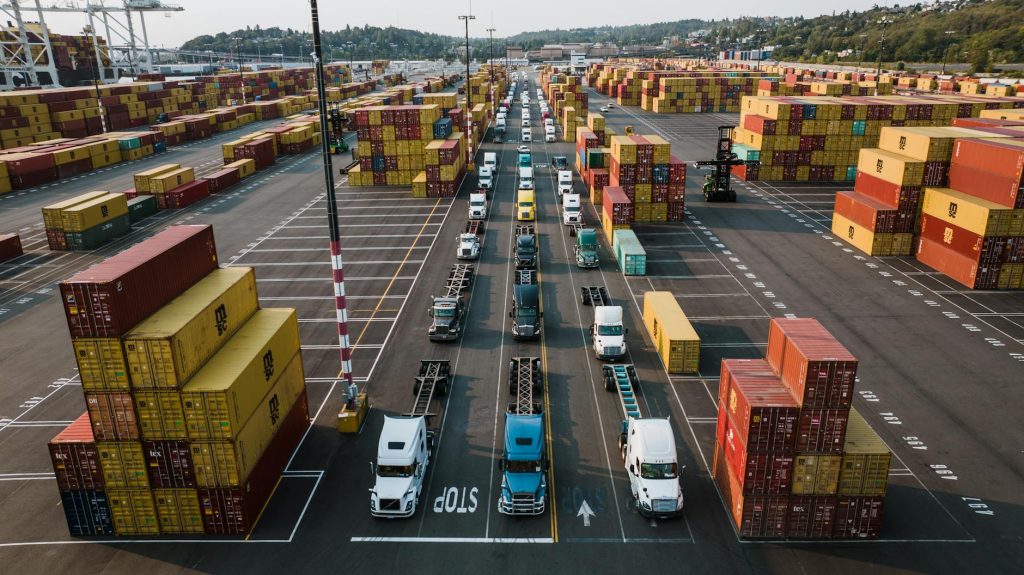 Freight trucks and containers moving through a North American logistics corridor