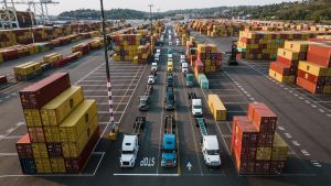 Freight containers and trucks representing North America trade lane expansion for freight forwarders across the U.S., Canada, and Mexico