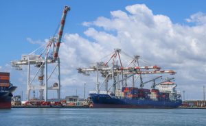 Container ship at Port of Brisbane for an article about network alternatives for Australia and New Zealand freight forwarders
