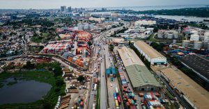 Aerial view of Dar es Salaam port with container yards, illustrating African freight corridor coordination.