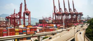Hong Kong container port showing cranes and stacked containers for Asia freight network coverage