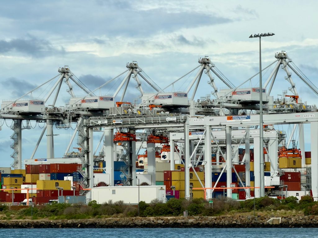 Containers at a seaport representing Australia and Oceania freight network membership