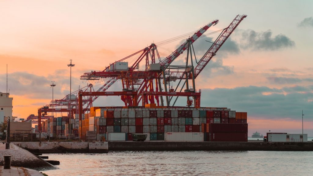 Global freight containers and cargo movement representing free freight forwarding network comparison