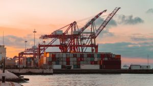 Global freight containers and cargo movement representing free freight forwarding network comparison