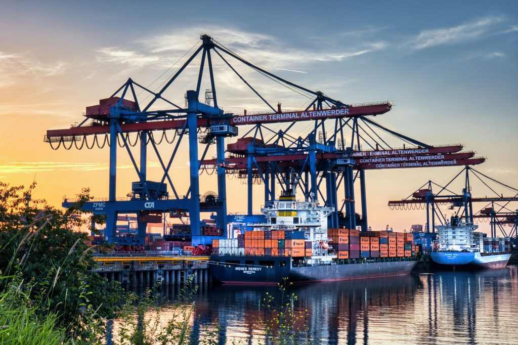 Global freight forwarding network buyer guide featured image showing containers and cargo operations