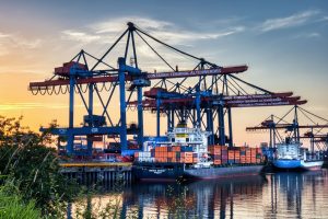 Global freight forwarding network buyer guide featured image showing containers and cargo operations