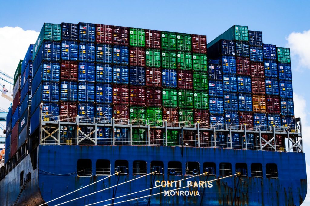 Cargo ship and stacked containers representing Latin America freight enquiries and partner qualification