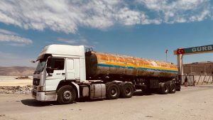Freight truck and container yard representing North America freight network payment protection for forwarders